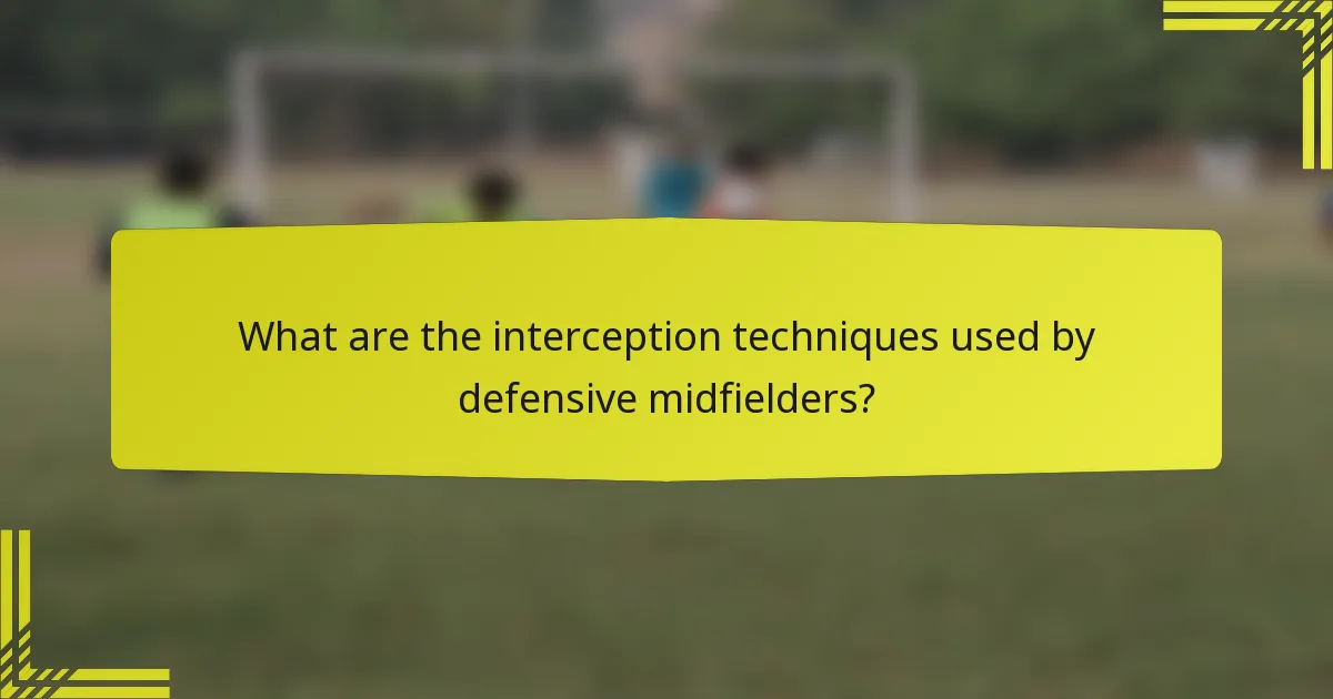 What are the interception techniques used by defensive midfielders?
